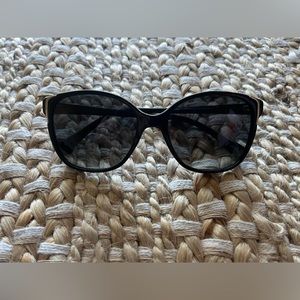 Brand new black Prada sunglasses. Comes with box and microfiber cleaning cloth.
